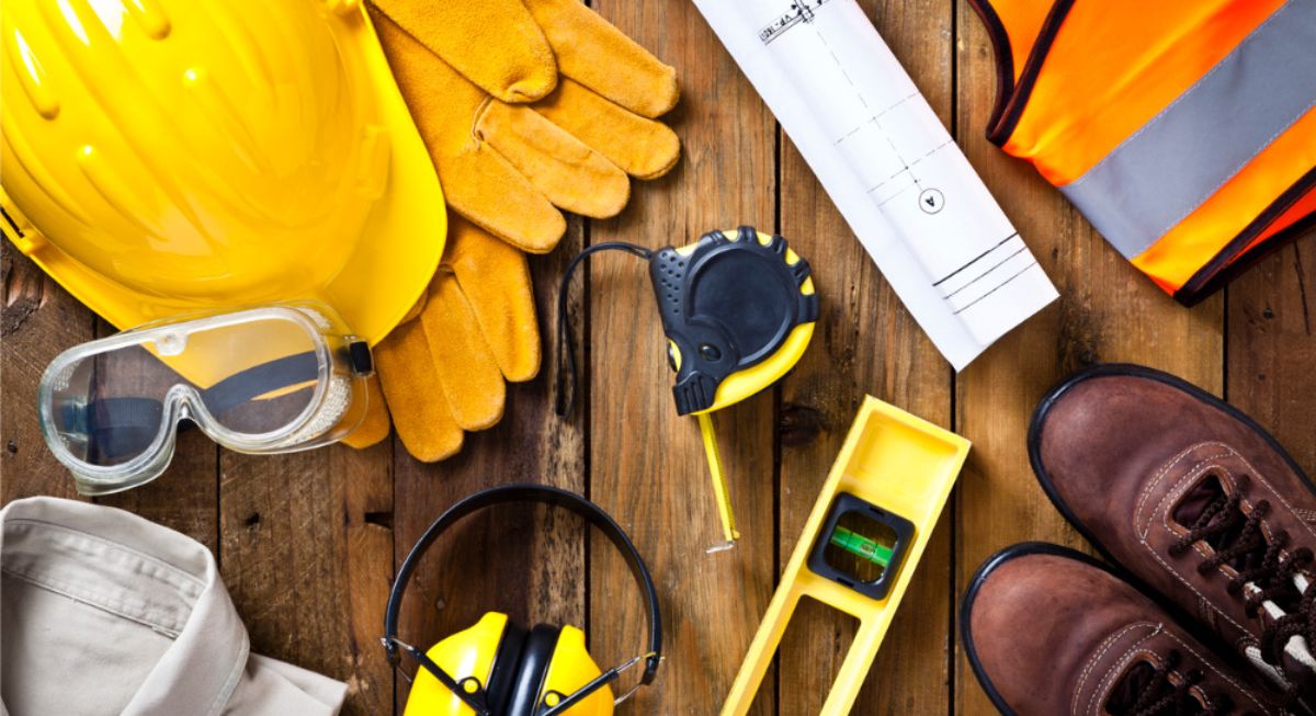 Safety tools and equipment on a wooden floor.