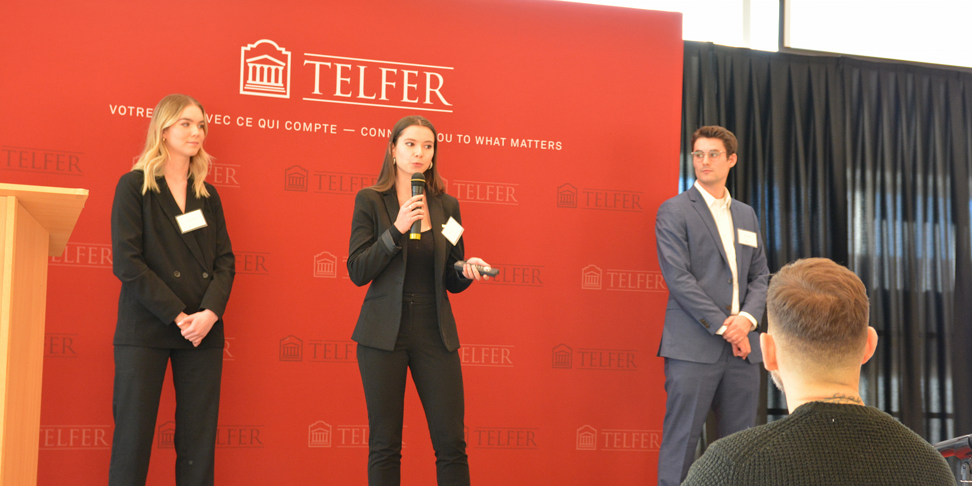 Students speaking on stage