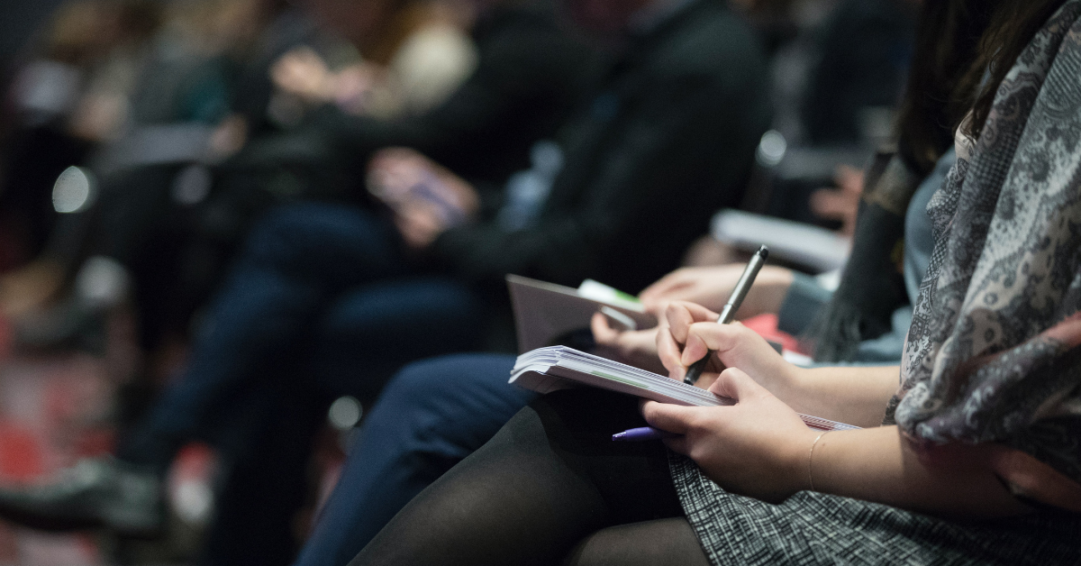 taking notes in meeting