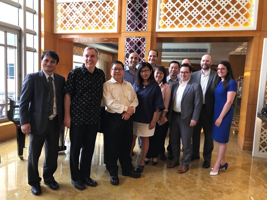 Tanya standing next to her EMBA classmates