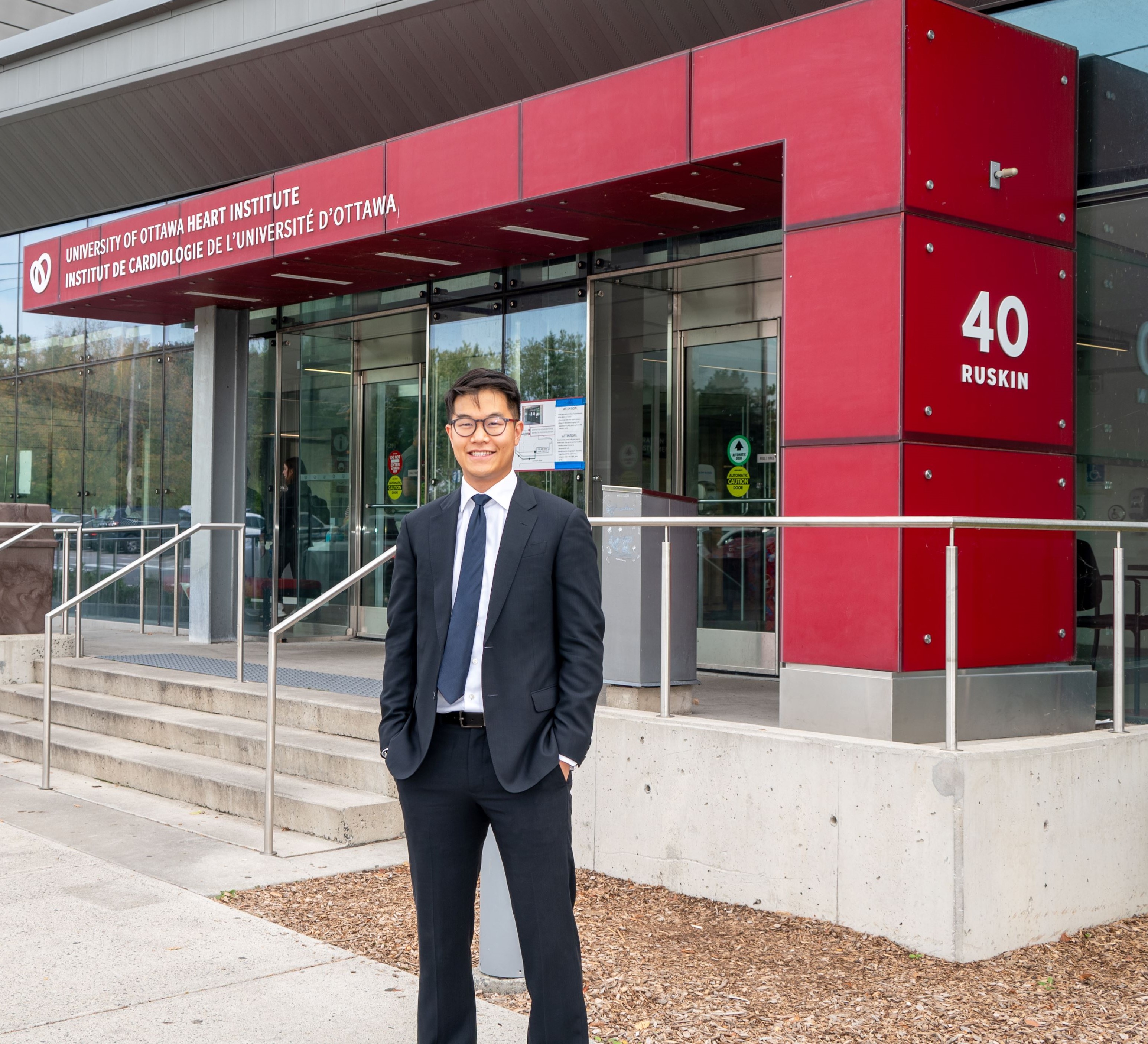 Telfer professor Christopher Sun in front of the University of Ottawa Heart Institute