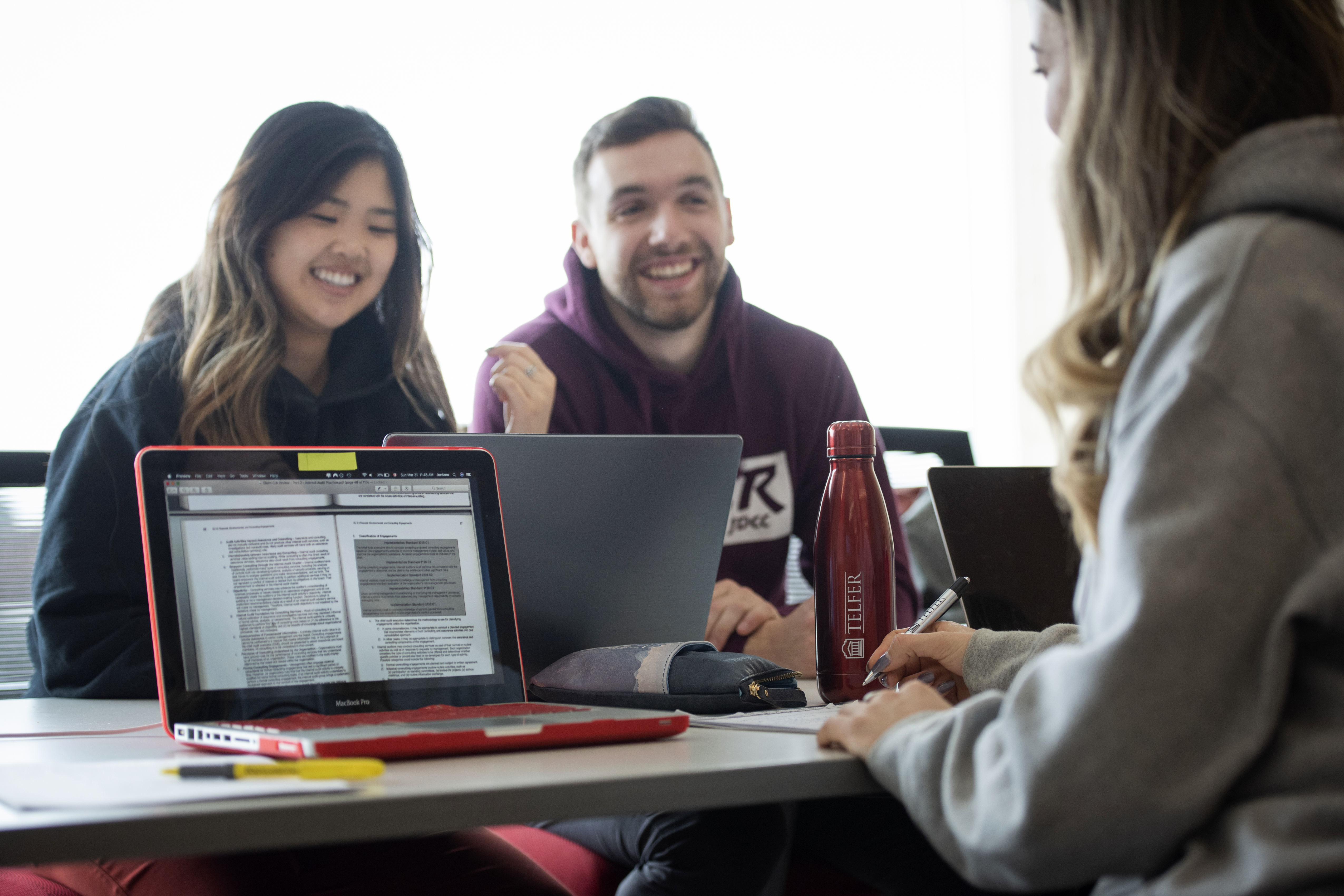 Telfer students studying on a laptop