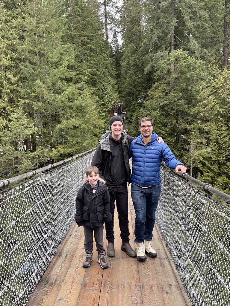 Tom, Rachid and his family on a bridge