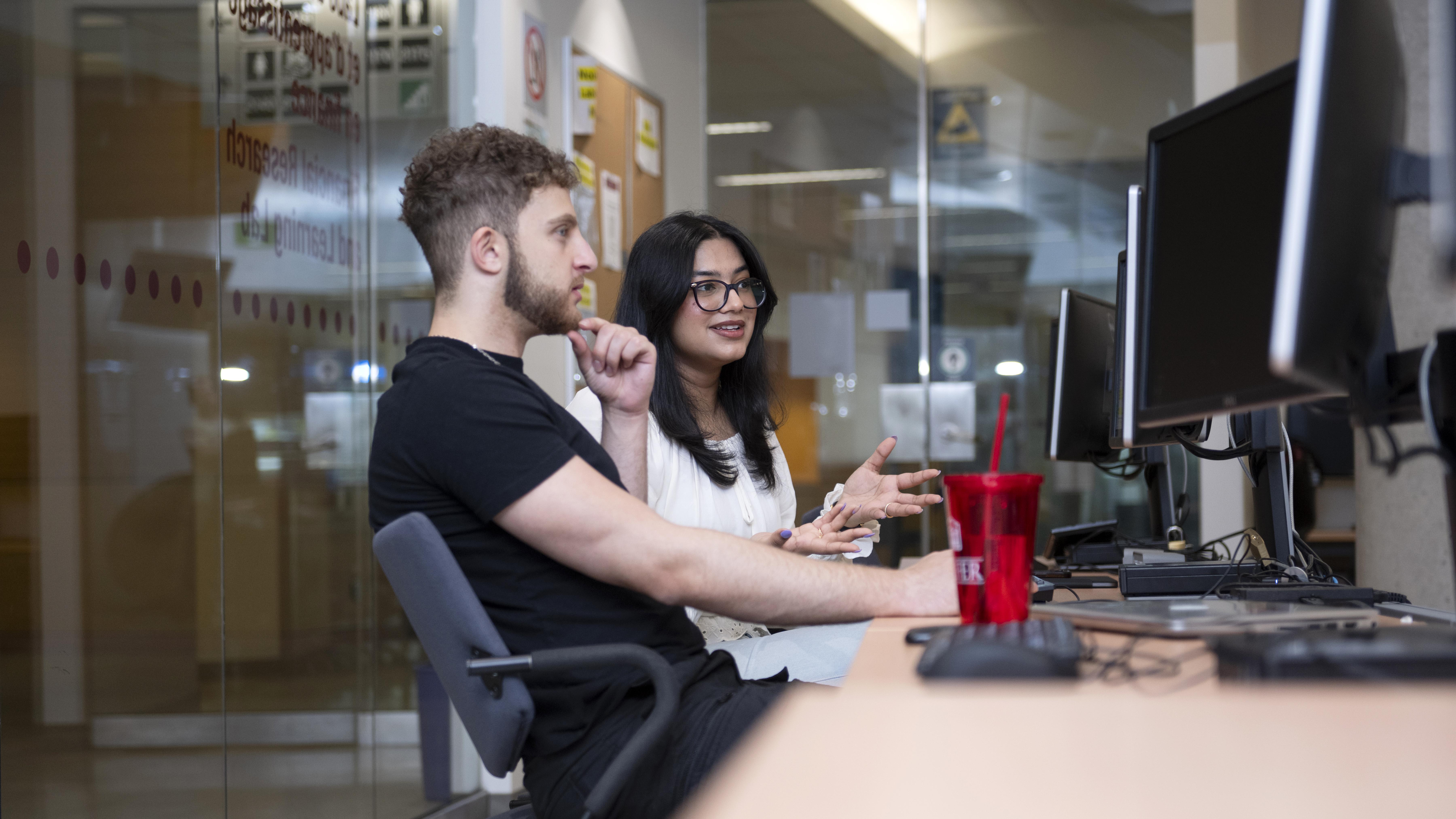 Two students working at computers