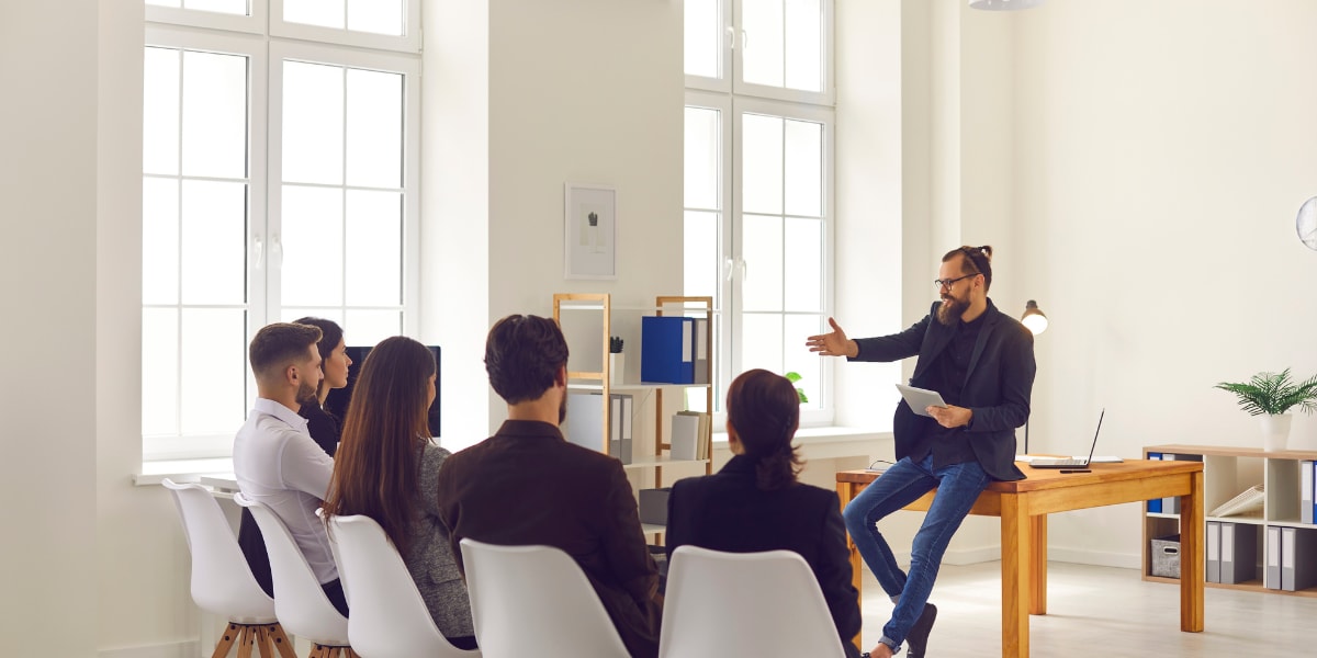 A person delivering a training session to an audience