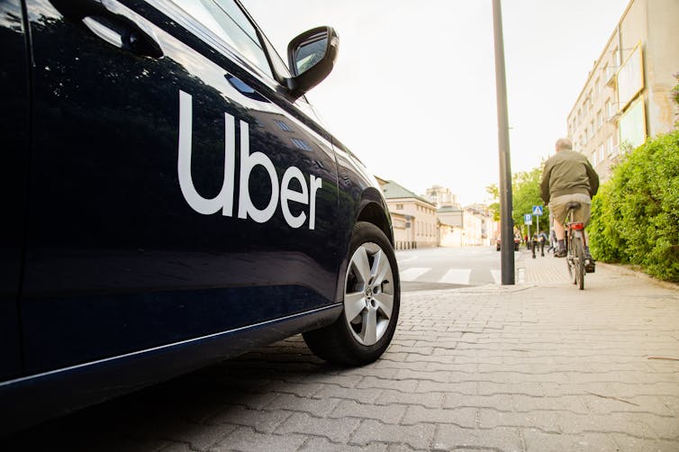 Black car with the Uber logo on it